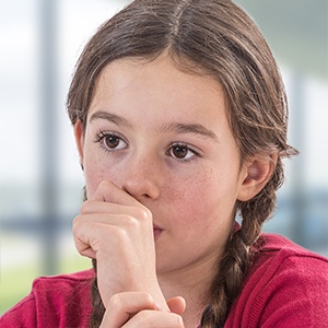 Child sucking thumb in need of thumb crib orthodontic appliance