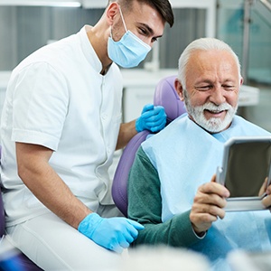 a dentist taking a digital impression of a patient’s mouth