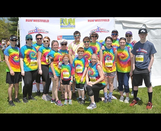 Team members at fun run community event