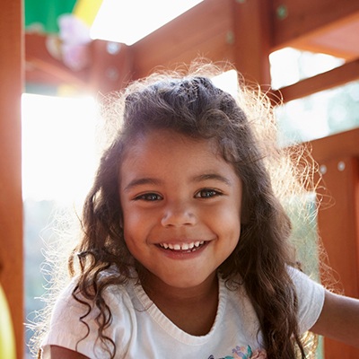 toddler-aged girl smiling 