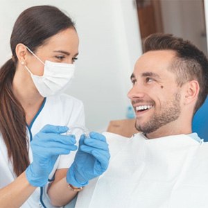 orthodontist in Enfield showing Invisalign to a patient 