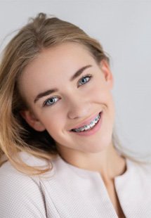 a woman near Westfield smiling with traditional metal braces