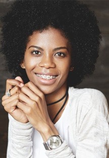 a woman near Westfield smiling with clear braces