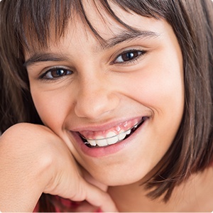 Preteen with phase one pediatric orthodontic appliance in place