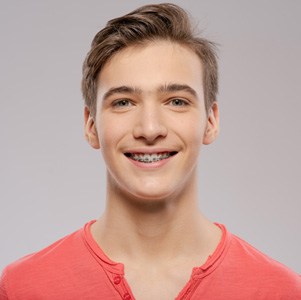 Portrait of smiling teen boy with braces