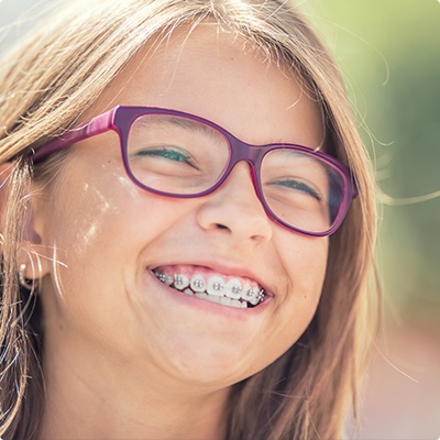 Young orthodontic patient with traditional braces