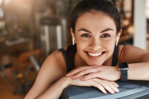 woman smiles while exercising