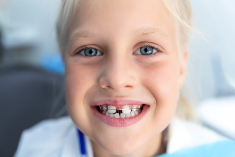 portrait of a child wearing braces