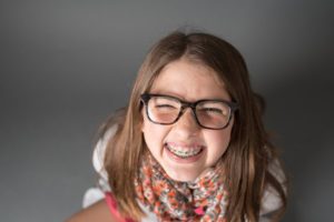 a child with braces visiting their orthodontist 