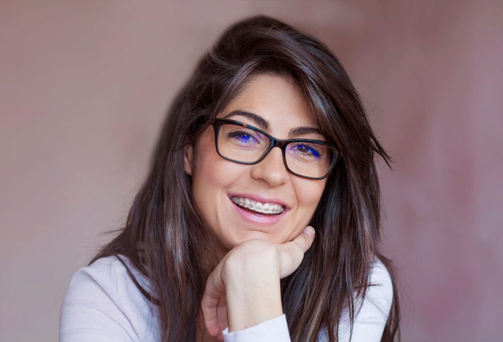 An adult woman wearing braces